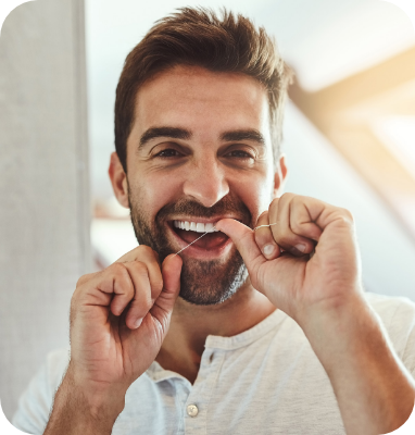 flossing teeth man