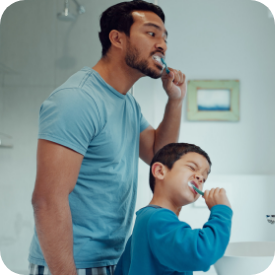 family brushing teeth